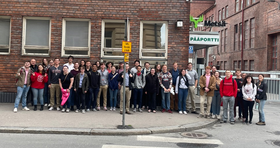 Group photo in front of a building - Day 8 Part 1 -Metsa Board Take Mill - Paper Science and Engineering Study Abroad